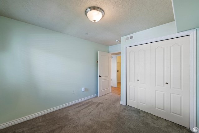 191 E Spencer Peak Way Unit I2, Draper, UT 84020 - unfurnished bedroom with carpet floors, a textured ceiling, a closet, and baseboards