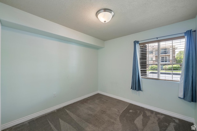 191 E Spencer Peak Way Unit I2, Draper, UT 84020 - spare room with dark colored carpet, a textured ceiling, and baseboards