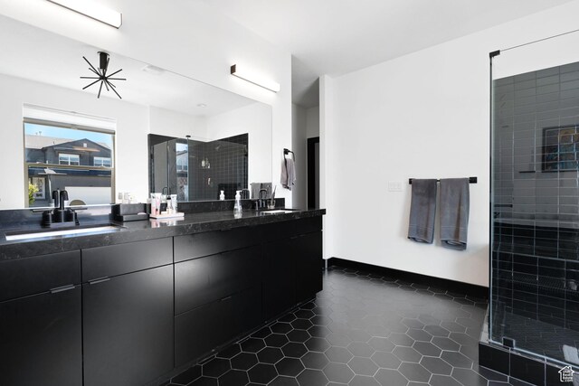189 N 20 W, Vineyard, UT 84059 - bathroom with double vanity, a shower stall, and tile patterned flooring