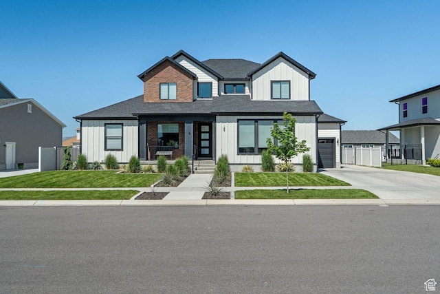 189 N 20 W, Vineyard, UT 84059 - modern inspired farmhouse featuring board and batten siding, a porch, driveway, and a garage