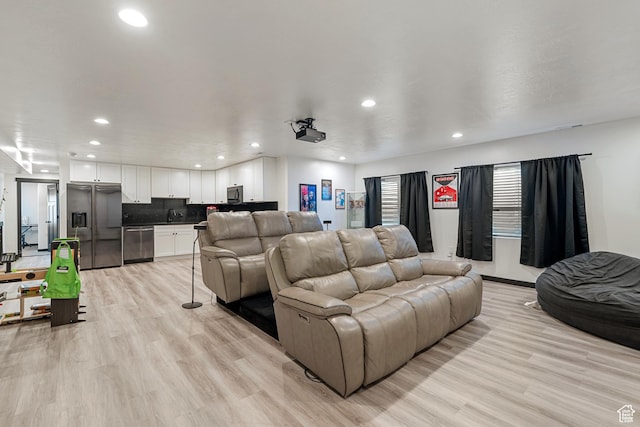 189 N 20 W, Vineyard, UT 84059 - home theater room with recessed lighting, a sink, and light wood finished floors