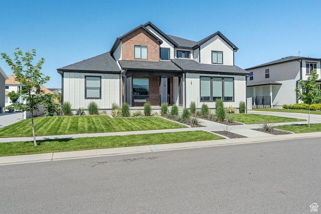 189 N 20 W, Vineyard, UT 84059 - modern inspired farmhouse featuring board and batten siding, a front lawn, and a shingled roof