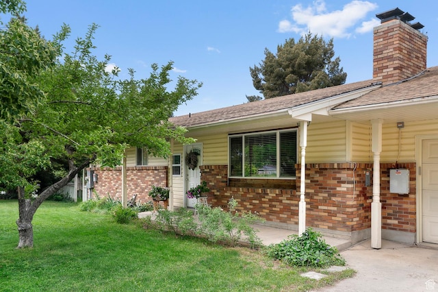 165 N 800 E, American Fork, UT 84003 - view of front of property featuring brick siding, a front yard, a chimney, a shingled roof, and a garage