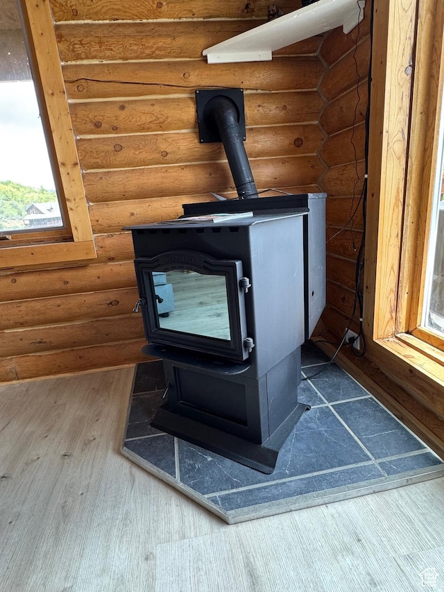 395 Hickock Dr Unit 309, Fish Haven, ID 83287 - detailed view of a wood stove, wood finished floors, and rustic walls