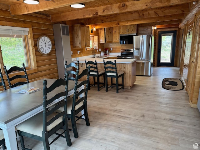 395 Hickock Dr Unit 309, Fish Haven, ID 83287 - dining space with log walls, wooden ceiling with exposed beams, and light wood-type flooring