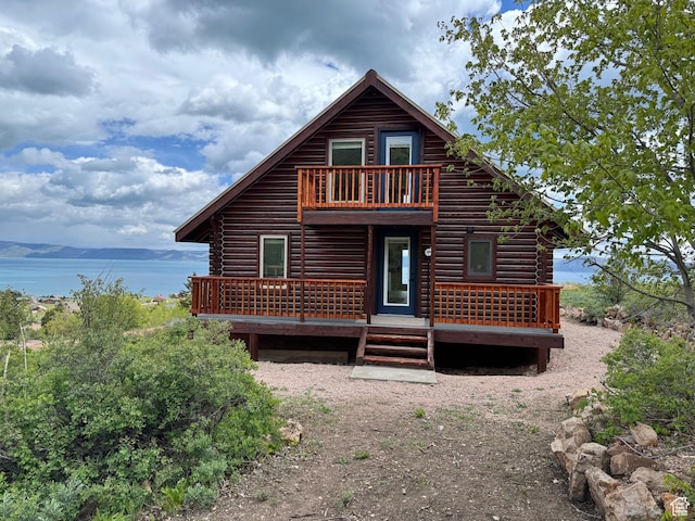 395 Hickock Dr Unit 309, Fish Haven, ID 83287 - rear view of house featuring log siding, a balcony, and a deck with water view