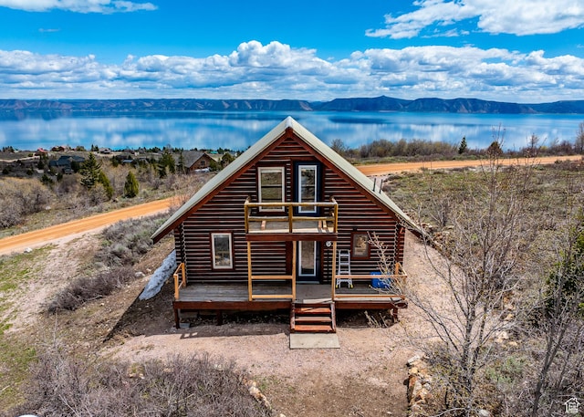 395 Hickock Dr Unit 309, Fish Haven, ID 83287 - view of front of house with a deck with water view and log exterior