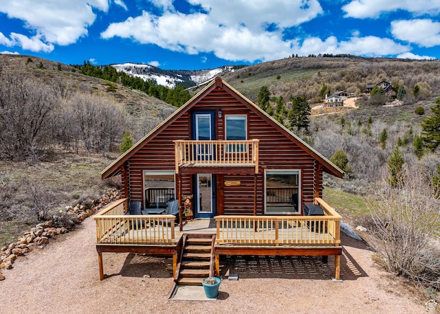 395 Hickock Dr Unit 309, Fish Haven, ID 83287 - log-style house with log siding, a deck with mountain view, and a balcony