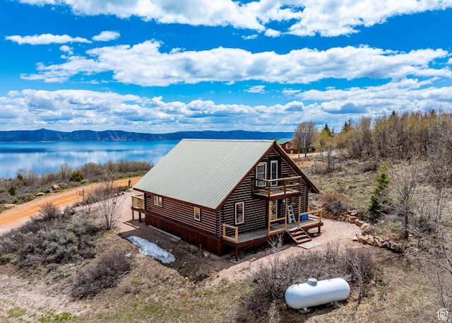 395 Hickock Dr Unit 309, Fish Haven, ID 83287 - view of side of property featuring log exterior, a deck with water view, and metal roof