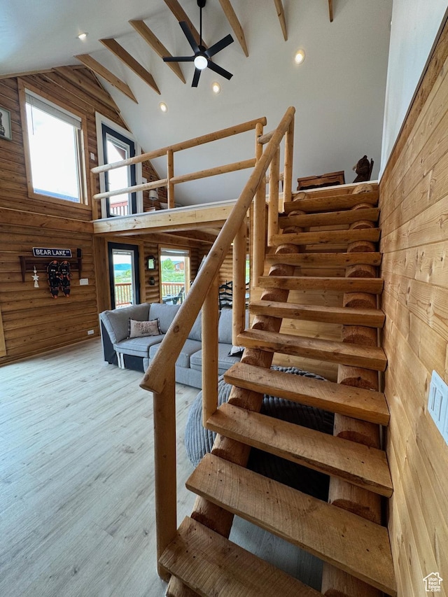 395 Hickock Dr Unit 309, Fish Haven, ID 83287 - stairway featuring wooden walls, high vaulted ceiling, ceiling fan, recessed lighting, and wood finished floors