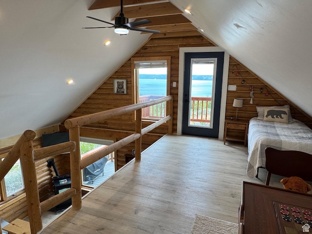 395 Hickock Dr Unit 309, Fish Haven, ID 83287 - bedroom featuring access to exterior, log walls, lofted ceiling, wood finished floors, and recessed lighting