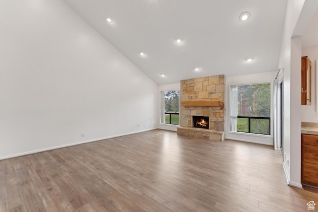 1679 Village Round Dr, Park City, UT 84098 - unfurnished living room featuring light wood-type flooring, healthy amount of natural light, a fireplace, recessed lighting, and baseboards