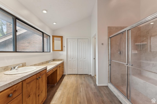 1679 Village Round Dr, Park City, UT 84098 - bathroom featuring lofted ceiling, two vanities, wood finished floors, a shower stall, and recessed lighting