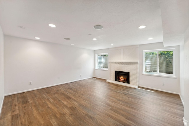 1679 Village Round Dr, Park City, UT 84098 - unfurnished living room with plenty of natural light, baseboards, wood finished floors, and recessed lighting