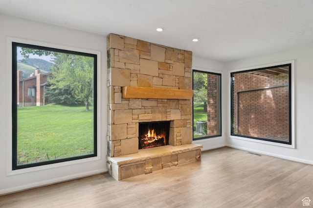 1679 Village Round Dr, Park City, UT 84098 - unfurnished living room with a fireplace, wood finished floors, baseboards, and recessed lighting