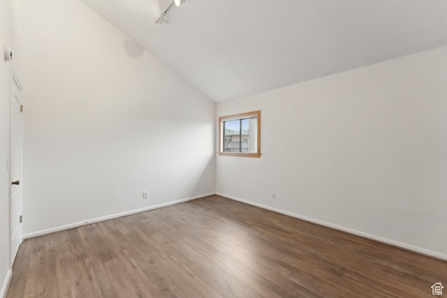 1679 Village Round Dr, Park City, UT 84098 - spare room featuring lofted ceiling, wood finished floors, and baseboards