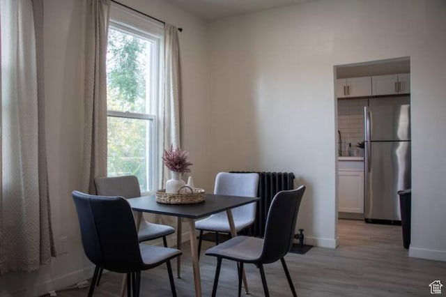 376 E Broadway, Salt Lake City, UT 84111 - dining room featuring light wood finished floors and baseboards