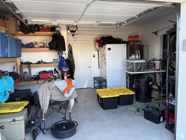 765 E Union St, Manti, UT 84642 - garage with freestanding refrigerator and a garage door opener