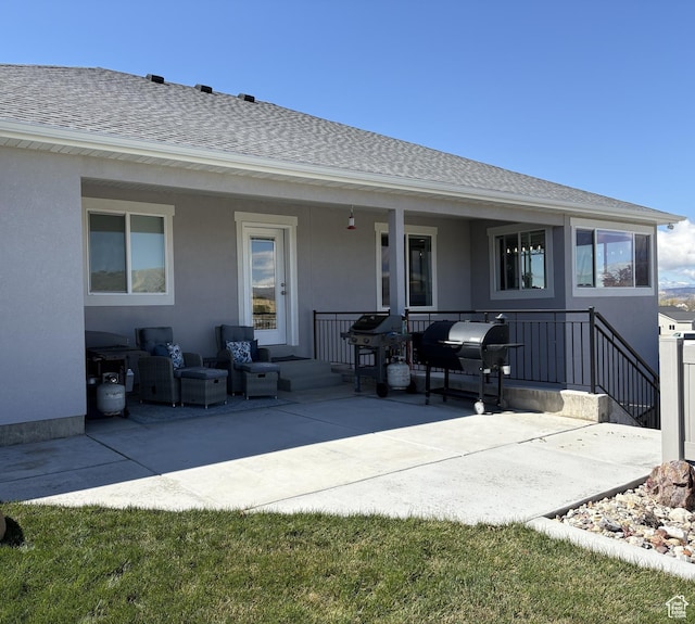 765 E Union St, Manti, UT 84642 - rear view of house with a shingled roof, stucco siding, and an outdoor hangout area