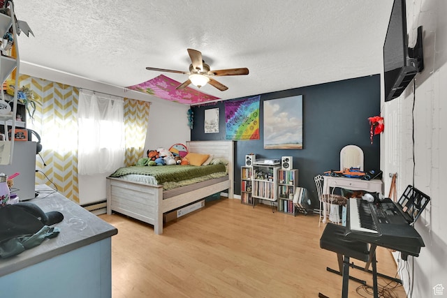 720 S 1650 E Unit B, Clearfield, UT 84015 - bedroom with a textured ceiling, light wood-style floors, and ceiling fan