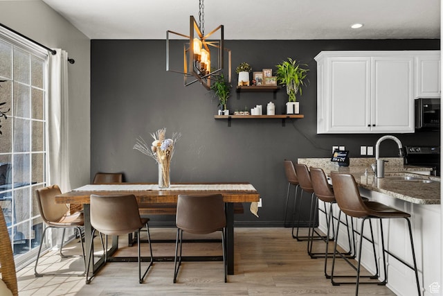 152 S 930 E, American Fork, UT 84003 - dining area featuring light wood-style floors, healthy amount of natural light, recessed lighting, and baseboards