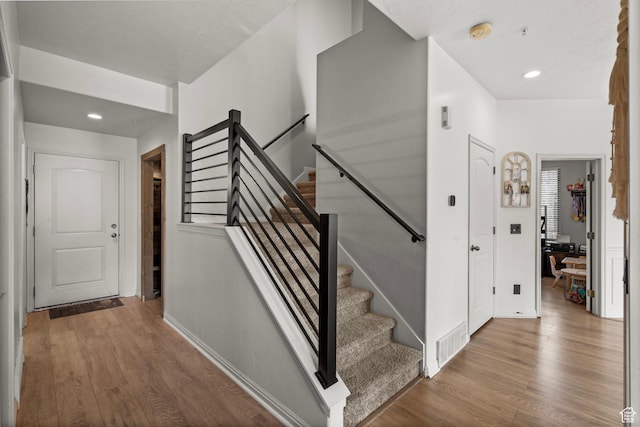 152 S 930 E, American Fork, UT 84003 - stairs featuring wood finished floors, baseboards, and recessed lighting