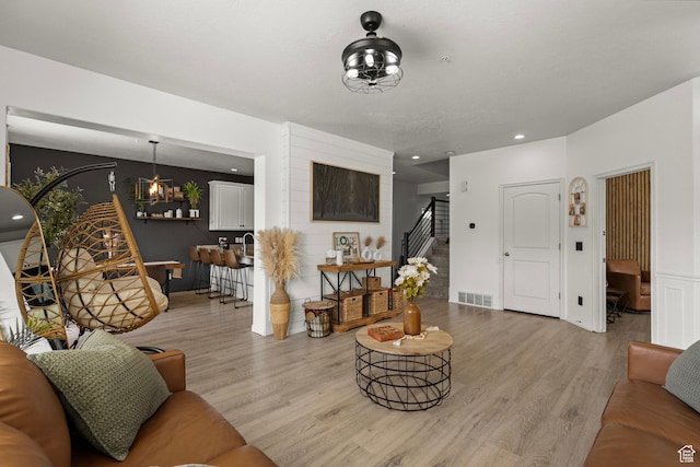 152 S 930 E, American Fork, UT 84003 - living room with light wood-type flooring, stairway, and recessed lighting