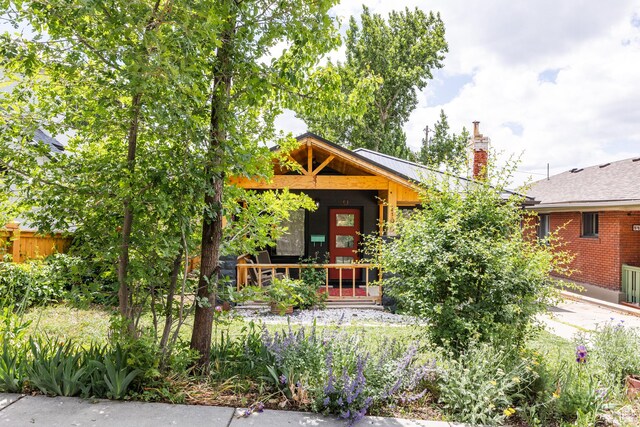 1190 E Sherman Ave S, Salt Lake City, UT 84105 - view of front facade featuring a chimney and covered porch