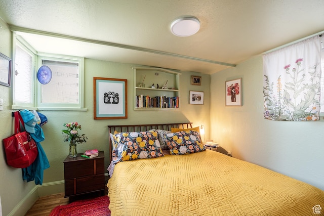 1190 E Sherman Ave S, Salt Lake City, UT 84105 - bedroom with wood finished floors and baseboards