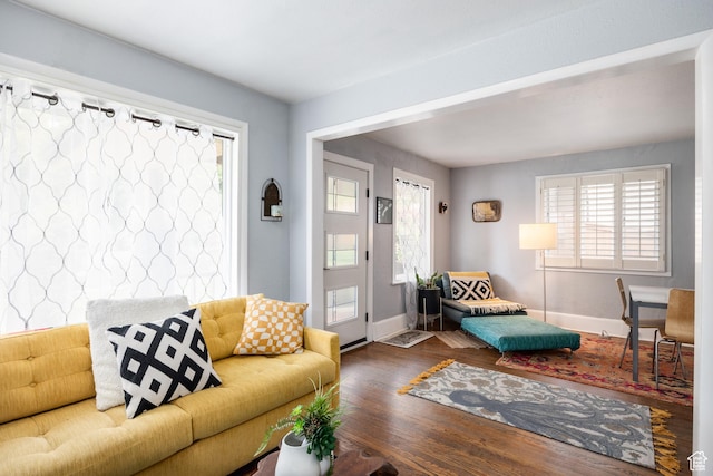 1190 E Sherman Ave S, Salt Lake City, UT 84105 - living area with wood finished floors, plenty of natural light, and baseboards