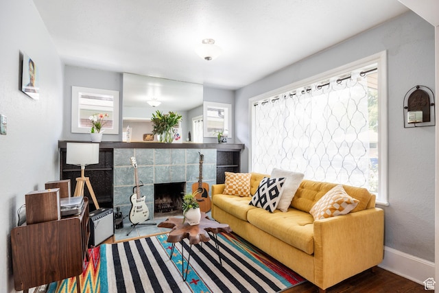1190 E Sherman Ave S, Salt Lake City, UT 84105 - living room with plenty of natural light, wood finished floors, a fireplace, and baseboards