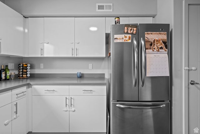 64 W 600 S Unit C205, Springville, UT 84663 - kitchen featuring freestanding refrigerator and white cabinetry