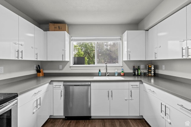 64 W 600 S Unit C205, Springville, UT 84663 - kitchen with stainless steel dishwasher, a sink, white cabinets, and a textured ceiling