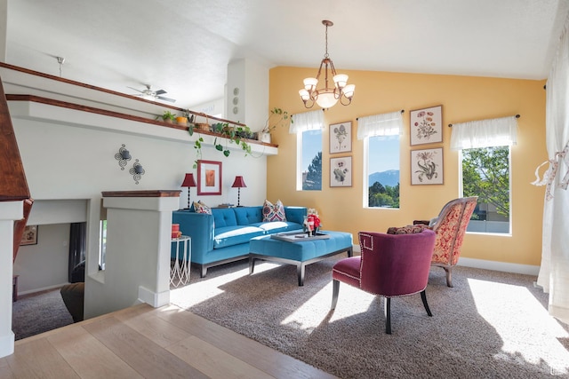 4952 W Buffalo Ct S, Riverton, UT 84096 - living room with lofted ceiling, wood finished floors, a chandelier, ceiling fan, and baseboards