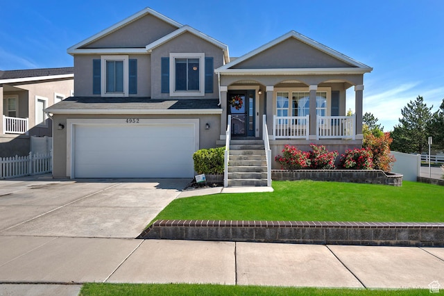 4952 W Buffalo Ct S, Riverton, UT 84096 - split level home with stucco siding, a garage, a porch, and concrete driveway