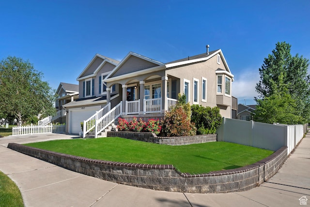 4952 W Buffalo Ct S, Riverton, UT 84096 - view of front of house with a porch, an attached garage, stucco siding, and concrete driveway