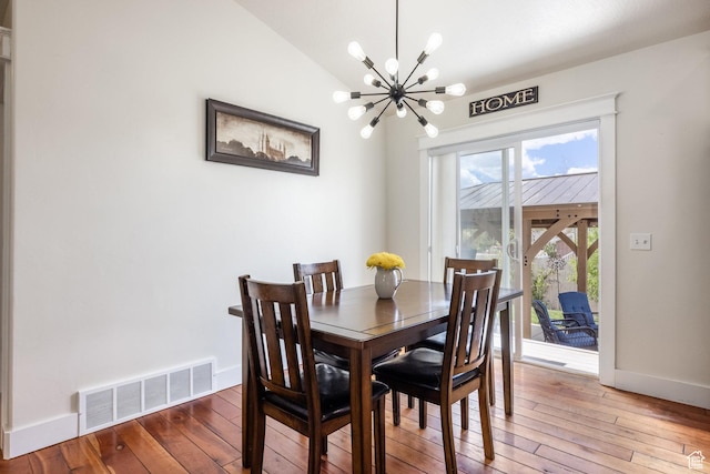 455 N 100 W Unit C-80, Kamas, UT 84036 - dining room featuring a chandelier, wood-type flooring, baseboards, and vaulted ceiling