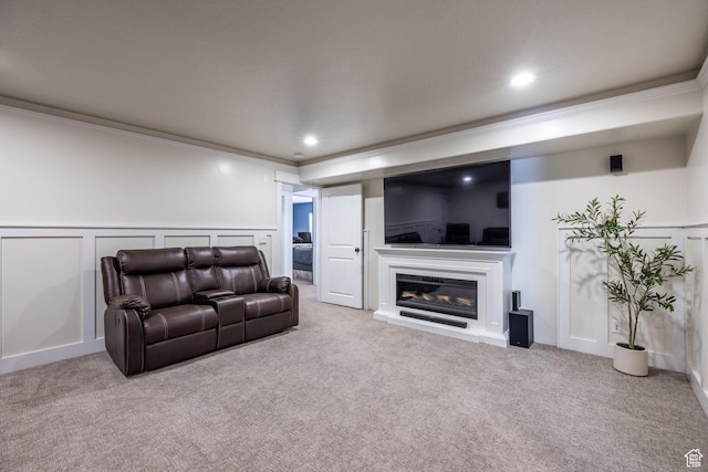 455 N 100 W Unit C-80, Kamas, UT 84036 - carpeted living area with a decorative wall, crown molding, a wainscoted wall, a glass covered fireplace, and recessed lighting