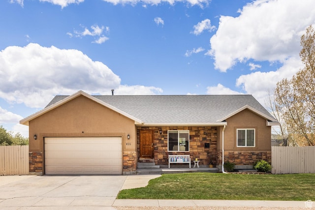 455 N 100 W Unit C-80, Kamas, UT 84036 - view of front of house with stone siding, covered porch, an attached garage, driveway, and stucco siding