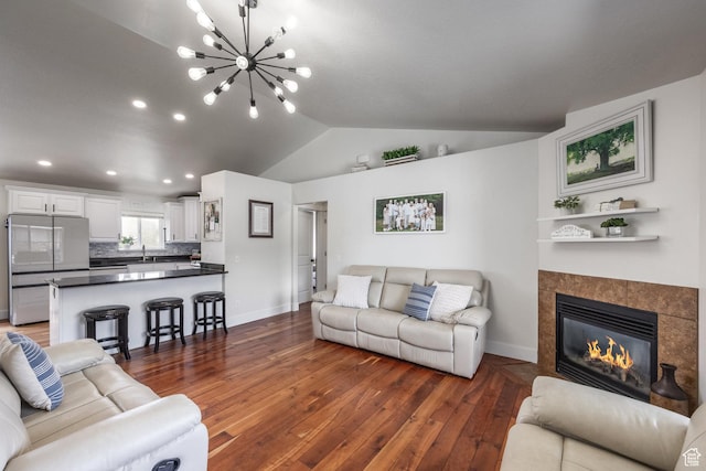 455 N 100 W Unit C-80, Kamas, UT 84036 - living area with baseboards, wood-type flooring, vaulted ceiling, a chandelier, and a fireplace