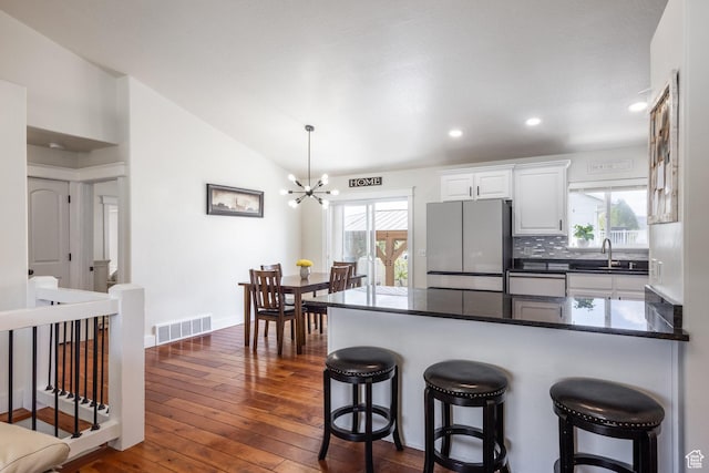 455 N 100 W Unit C-80, Kamas, UT 84036 - kitchen featuring freestanding refrigerator, a sink, a chandelier, vaulted ceiling, and a peninsula