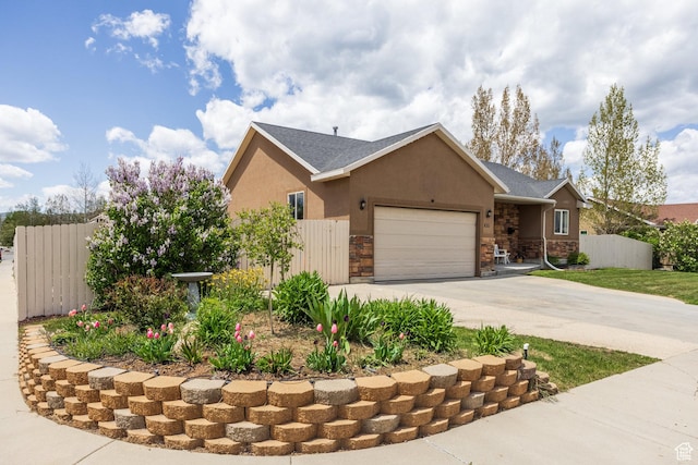 455 N 100 W Unit C-80, Kamas, UT 84036 - view of front of house with an attached garage, driveway, stone siding, and stucco siding