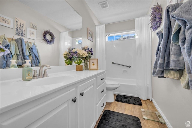 519 W 40 N, Orem, UT 84057 - bathroom featuring vanity, wood finished floors, toilet, shower / bathtub combination with curtain, and baseboards