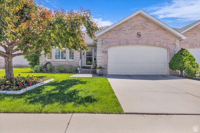 519 W 40 N, Orem, UT 84057 - view of front of house with a garage, concrete driveway, a front lawn, and brick siding