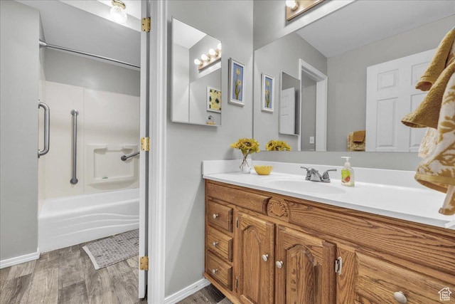 519 W 40 N, Orem, UT 84057 - bathroom featuring wood finished floors, vanity, shower / washtub combination, and baseboards