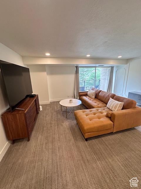 875 S Donner Way E Unit 208, Salt Lake City, UT 84108 - carpeted living room with baseboards, recessed lighting, and a textured ceiling