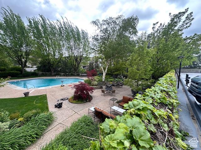 875 S Donner Way E Unit 208, Salt Lake City, UT 84108 - swimming pool featuring a patio area