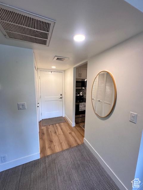 875 S Donner Way E Unit 208, Salt Lake City, UT 84108 - hallway featuring baseboards, light wood-style flooring, and recessed lighting