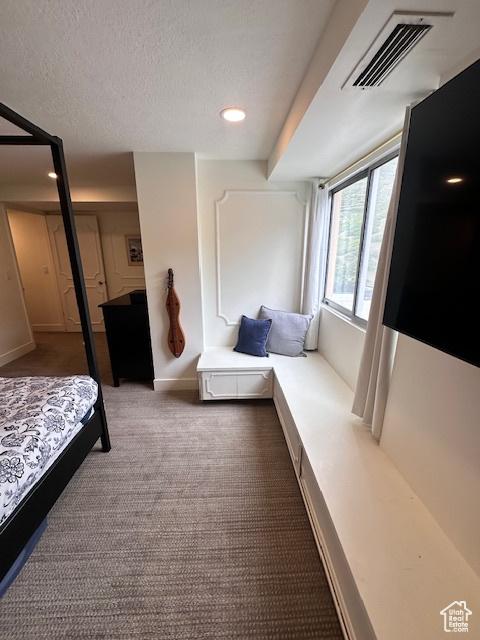 875 S Donner Way E Unit 208, Salt Lake City, UT 84108 - bedroom with carpet flooring, baseboards, a textured ceiling, and recessed lighting