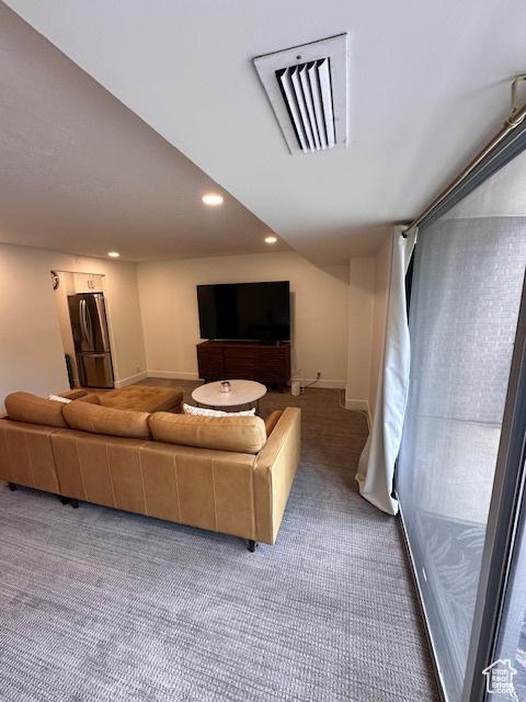 875 S Donner Way E Unit 208, Salt Lake City, UT 84108 - carpeted living area with baseboards and recessed lighting